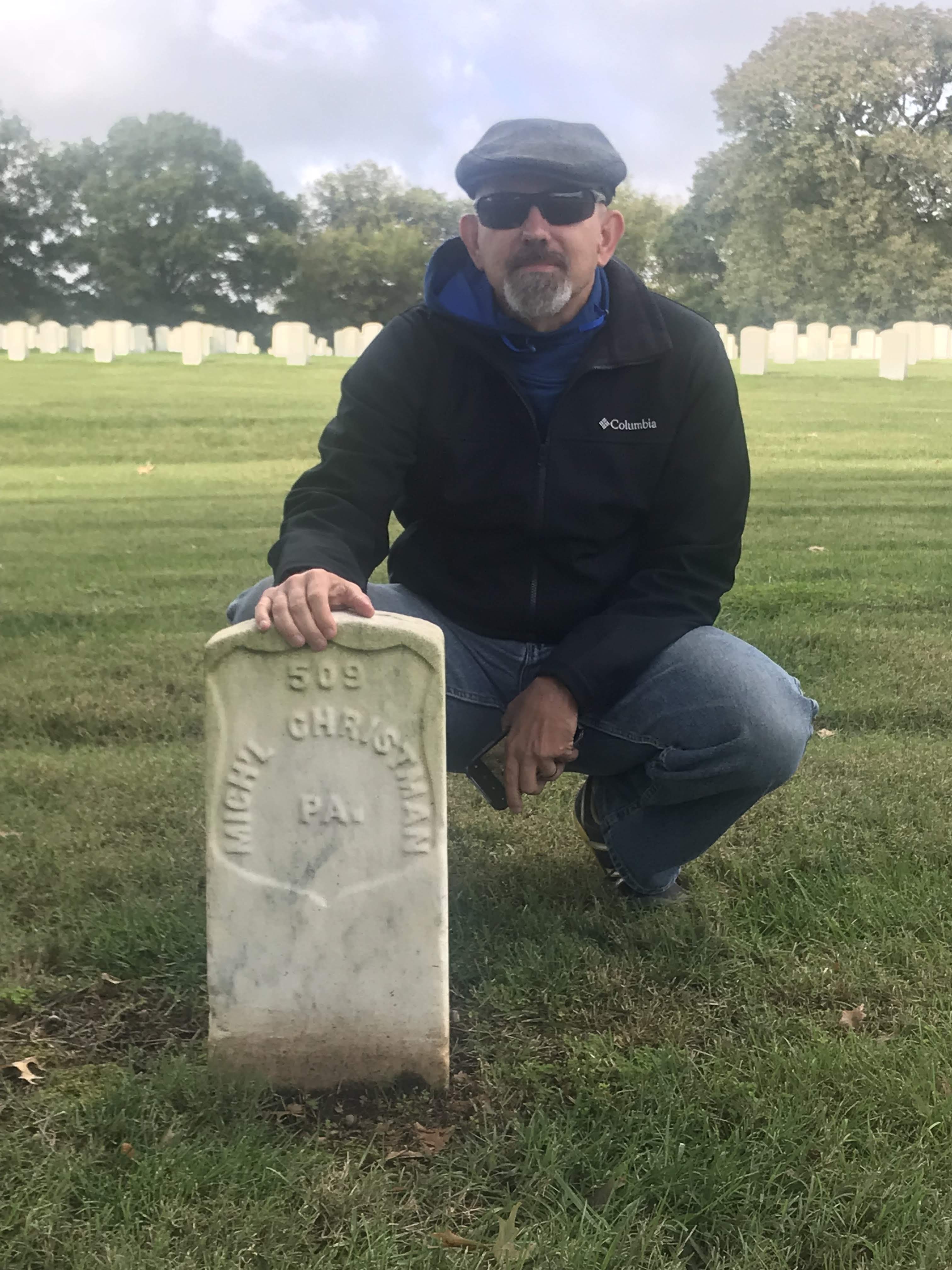 Charlie Heckman at Michael Crissman's grave in Nashville National Cemetery
