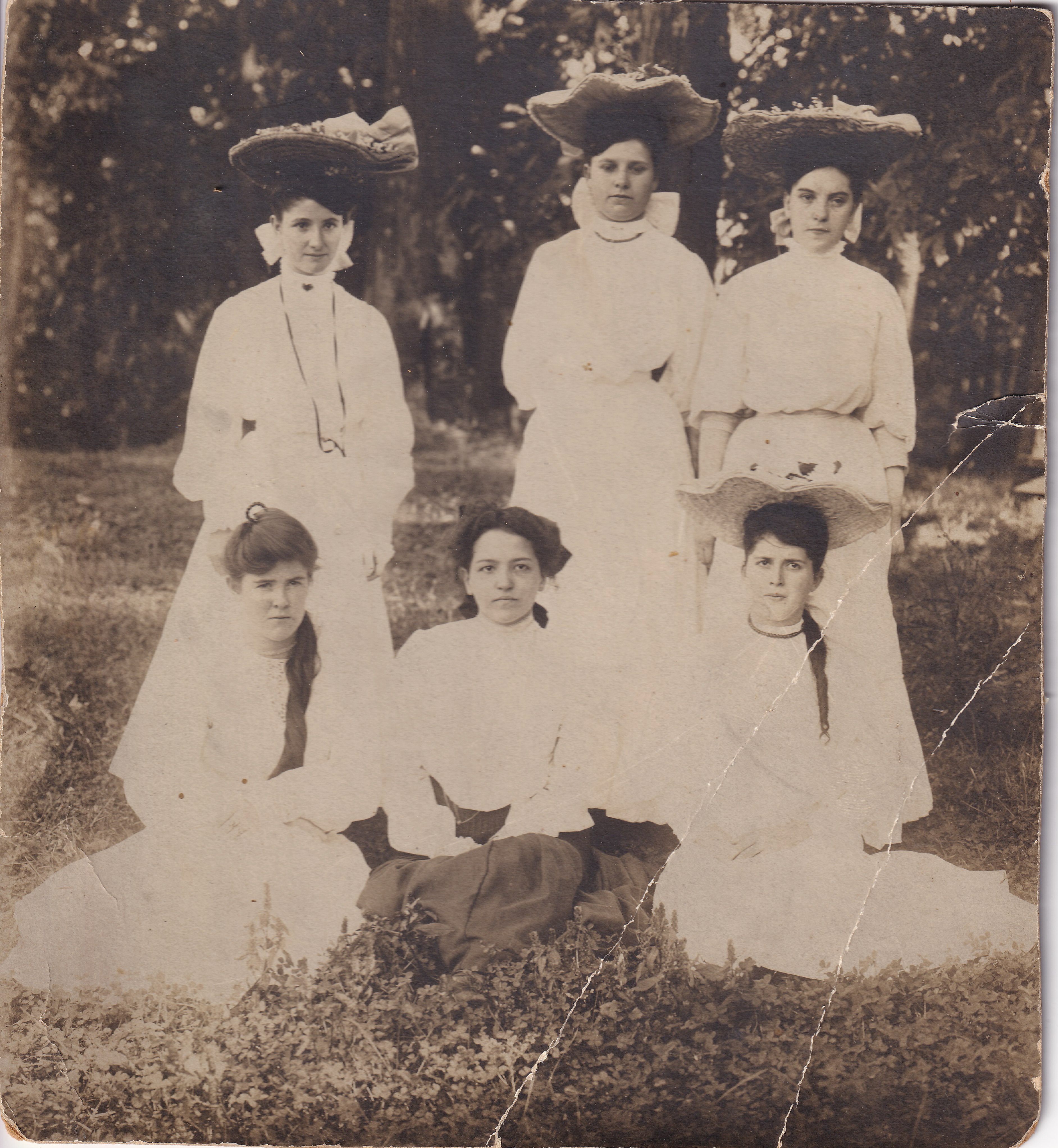 Nannie Bowser with five other women, 1905. Nannie is identified in the family catalog as front row, right; the other women remain unidentified. Date and identification are family-supplied.