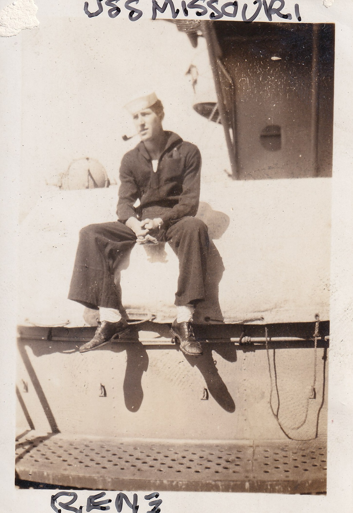 Renay Heckman seated in Navy uniform in a photograph annotated USS Missouri and Rene